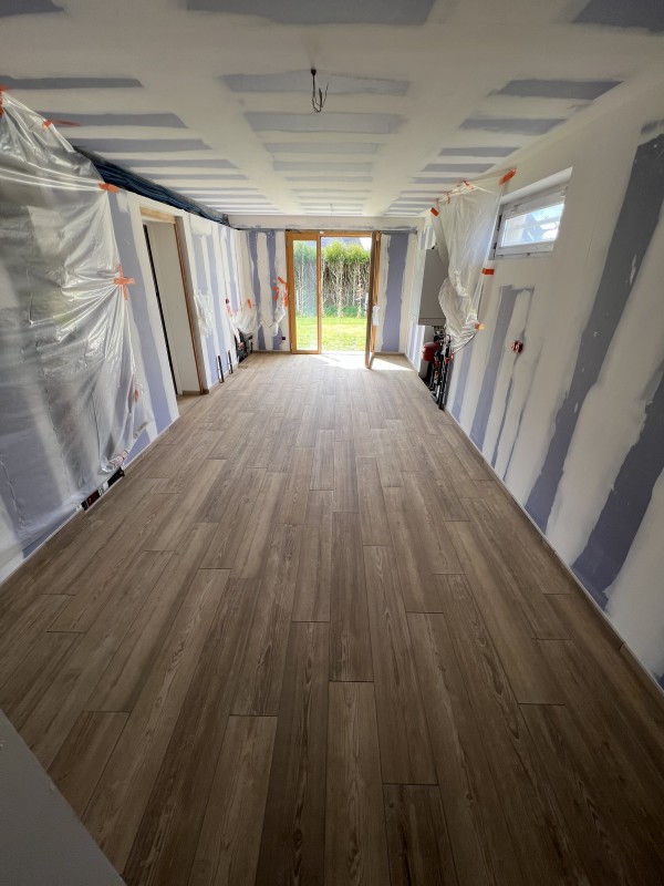 Réalisation sur devis d'une pose d'isolant TMS de 100 mm et d'un carrelage imitation bois secteur Dieppe 76